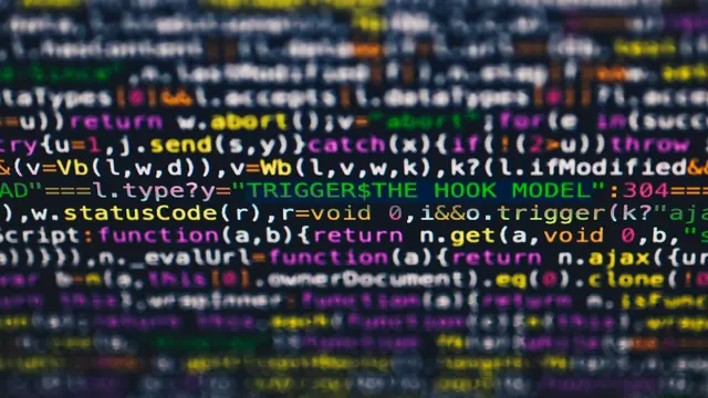 Close-up of colorful programming code displayed on a screen