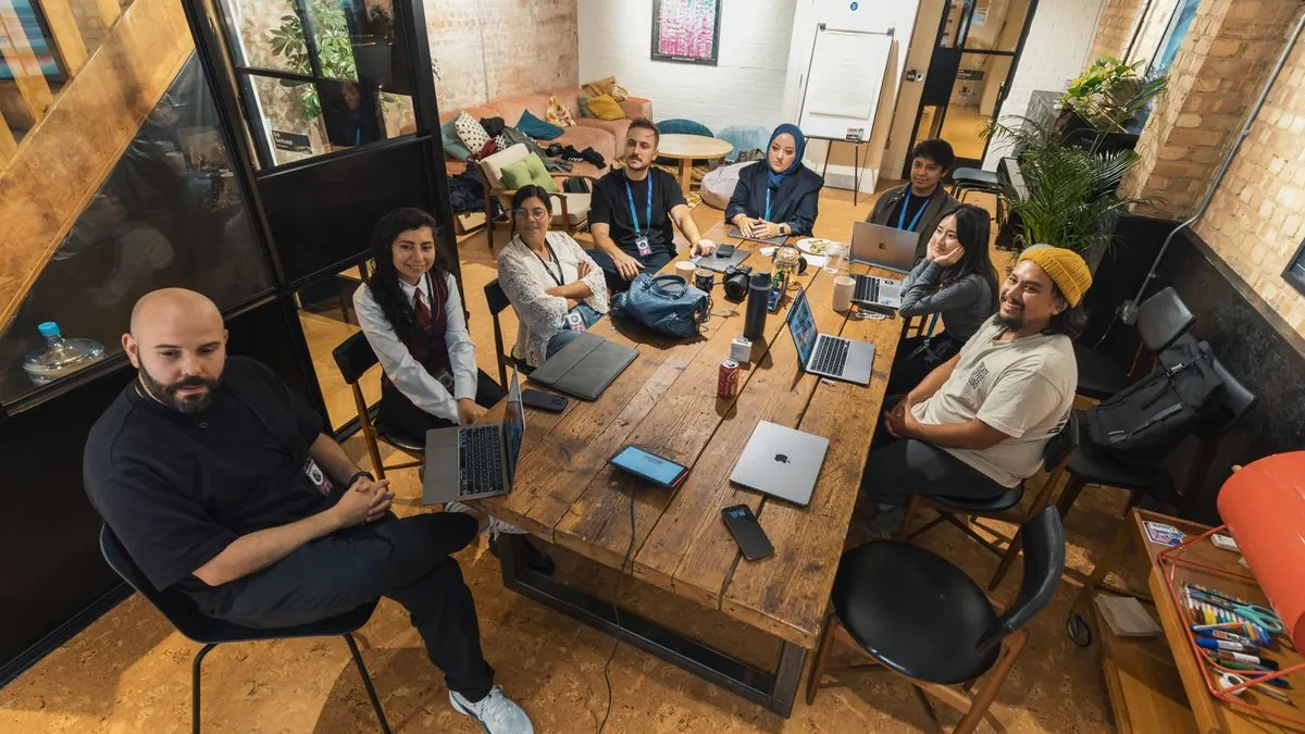 Team of engineers and product staff collaborating in a modern office