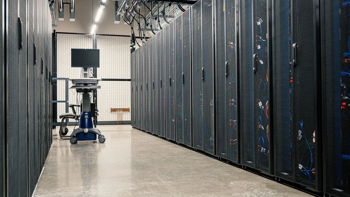 Rows of server racks in a modern data center corridor