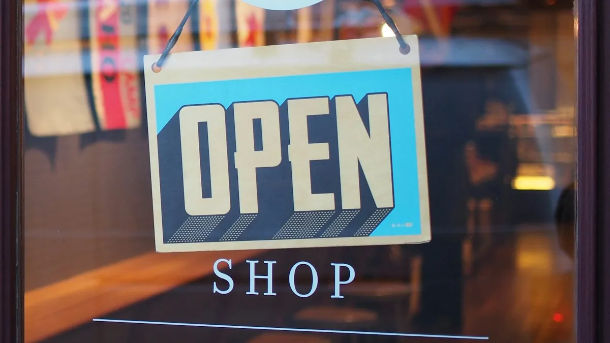 An open sign hanging in a shop window