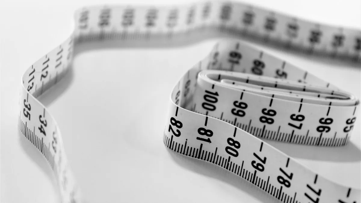 A white measuring tape coiled on a table