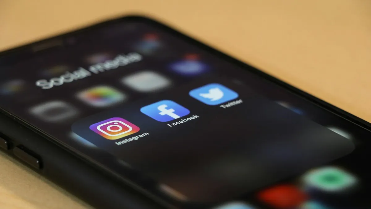 A phone showing a folder of social media apps