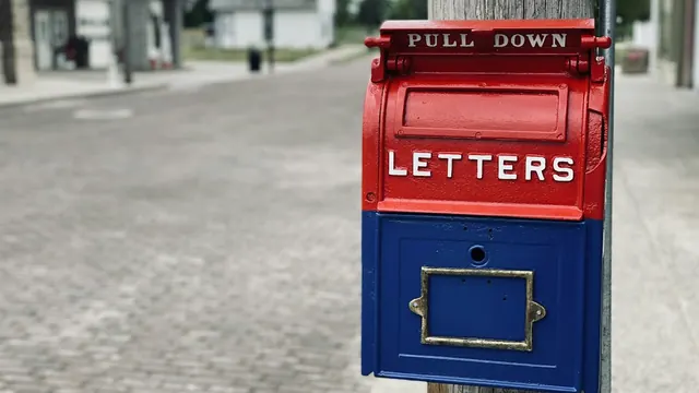 A red and blue post box labelled letters