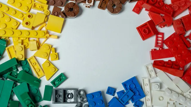 Building bricks sorted by colour around an empty space