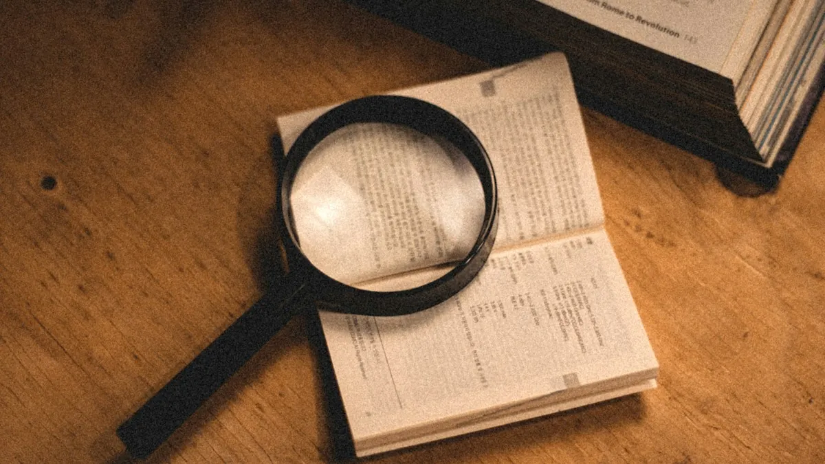 A magnifying glass lying on an open book