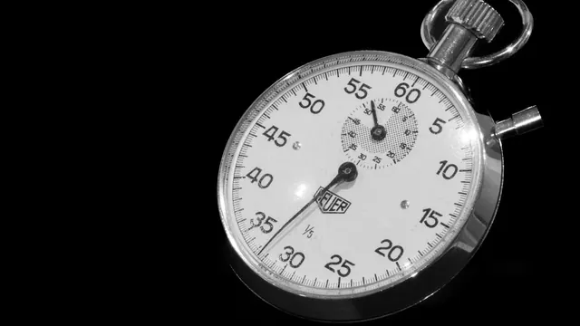 A stopwatch on a black background