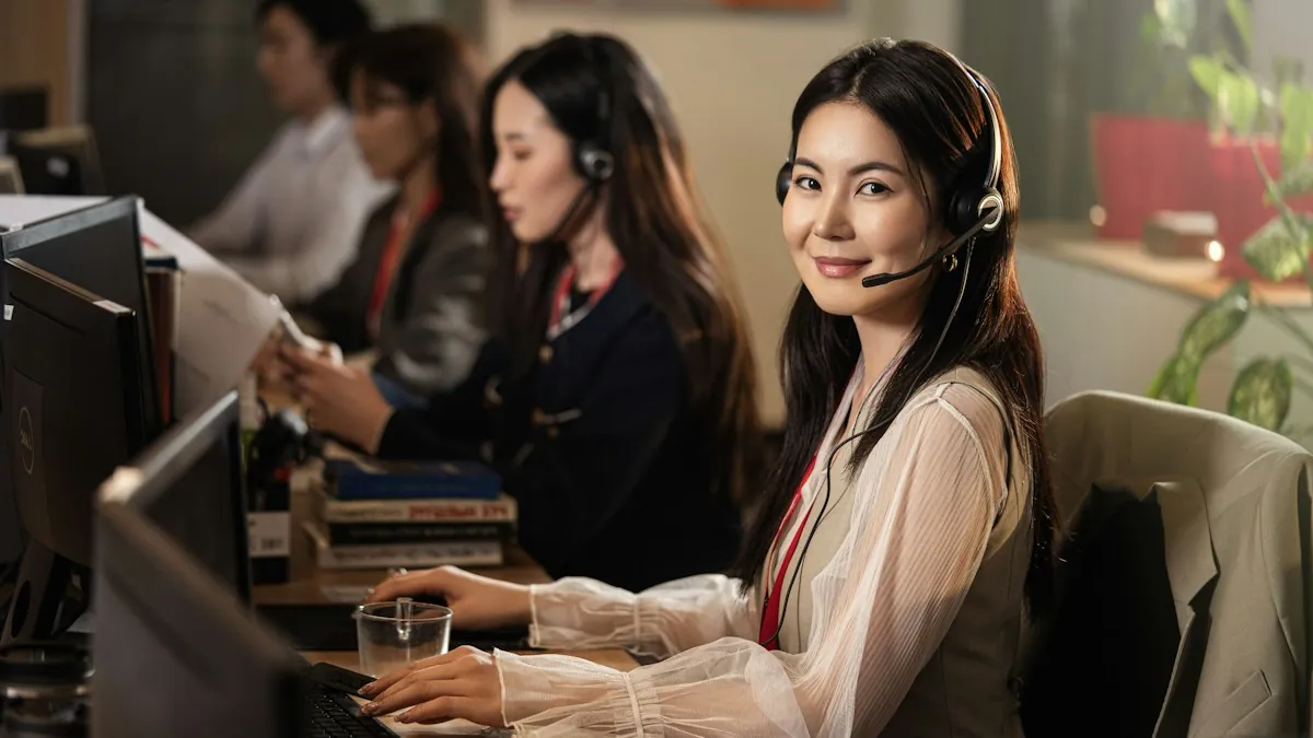 Customer support staff wearing headsets at their computers